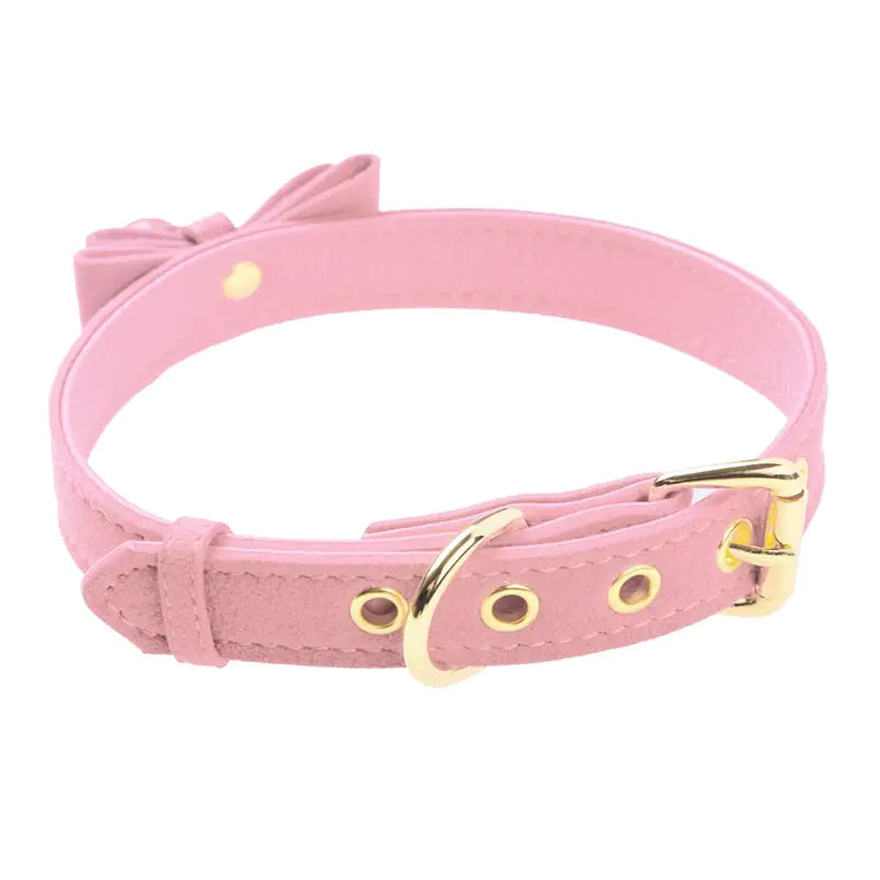 A stylish black choker collar necklace featuring a small, shiny bell hanging in the center, perfect for fashionable or costume wear