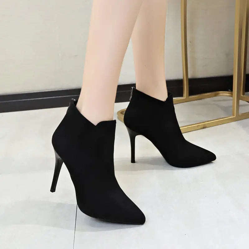 Modern women's ankle boots featuring a sleek pointed toe and durable construction