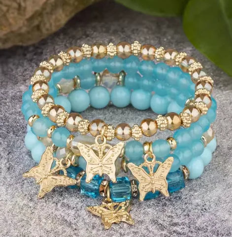 A close-up of colorful Butterfly Bliss Beaded Bracelets featuring intricate butterfly charms and vibrant beads for a stylish and playful accessory