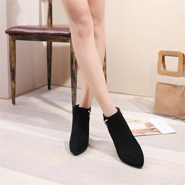 Elegant pointed toe chunky heel ankle boots featuring a stylish side zipper for easy wear and a modern, fashionable look