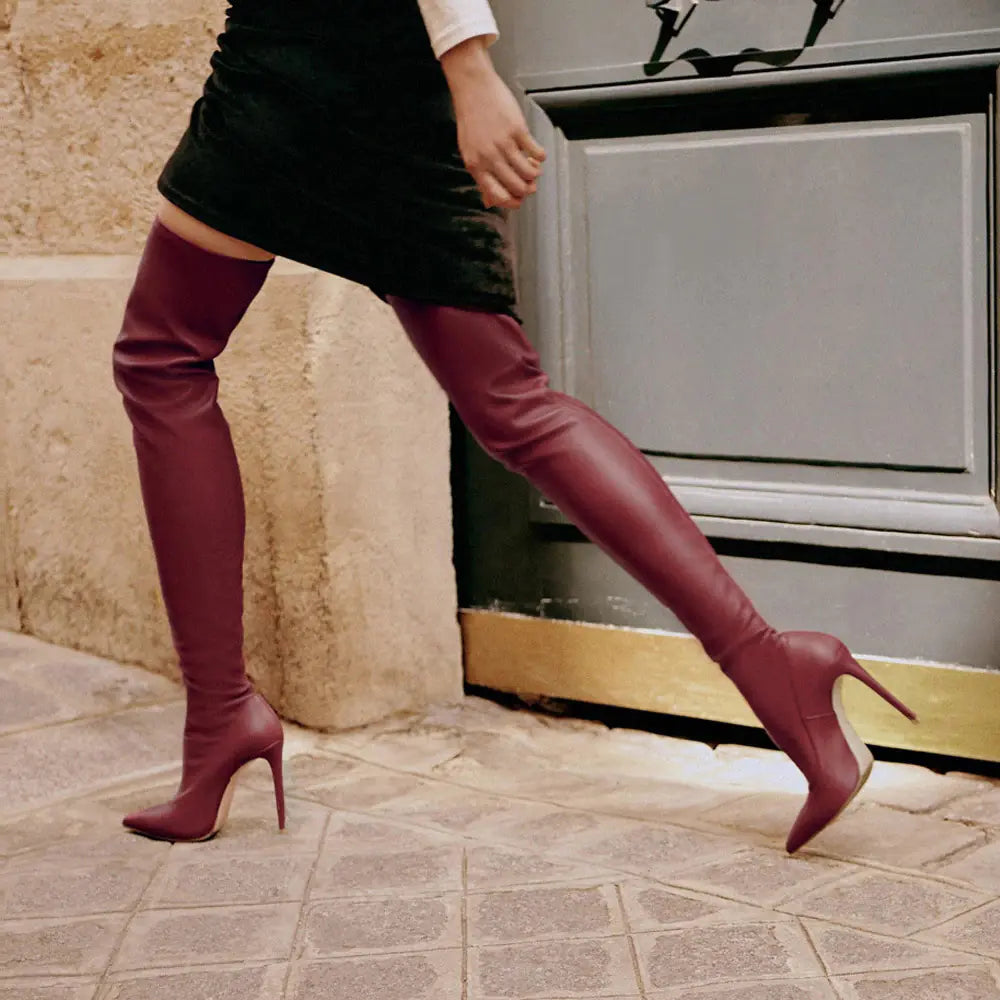 Modern black over-the-knee stiletto boots with microfiber shaft and sleek pointed toe