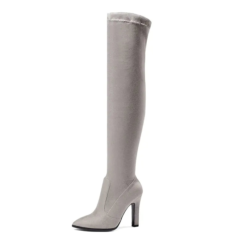 Elegant women's suede high-heeled booties featuring stylish design, pointed toes, and trendy ankle-length silhouette