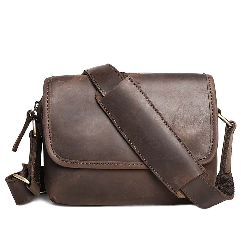 Stylish leather crossbody bag designed to hold an iPad and essential items