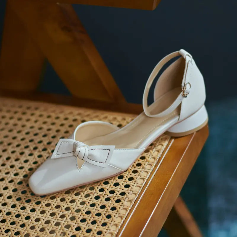 Elegant Mary Jane bow sandals featuring a thick low heel, perfect for stylish, comfortable summer footwear