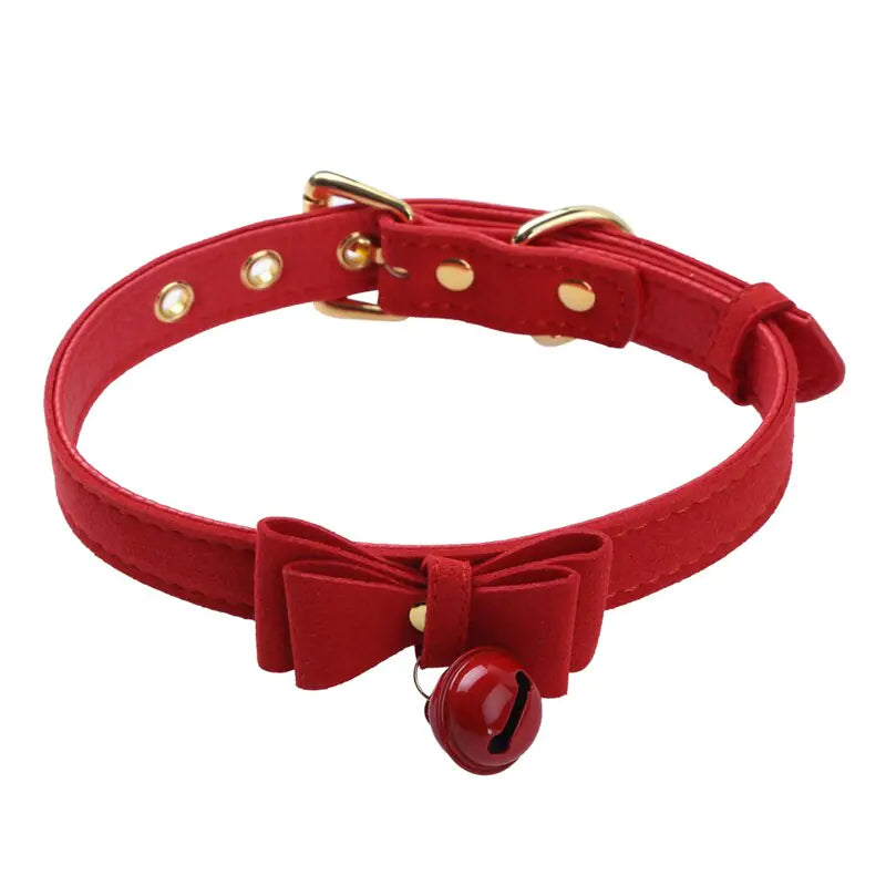 A stylish black choker collar necklace featuring a small metallic bell for a trendy, edgy look