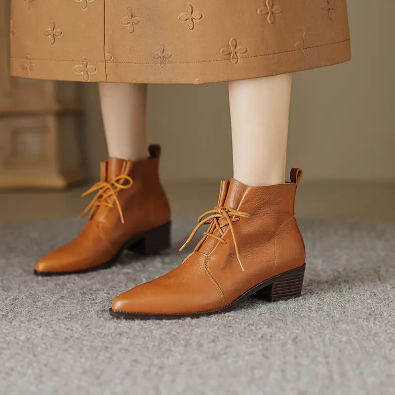 A stylish pair of pointed-toe lace-up chunky heel Martin boots crafted from high-quality cowhide leather with sleek design