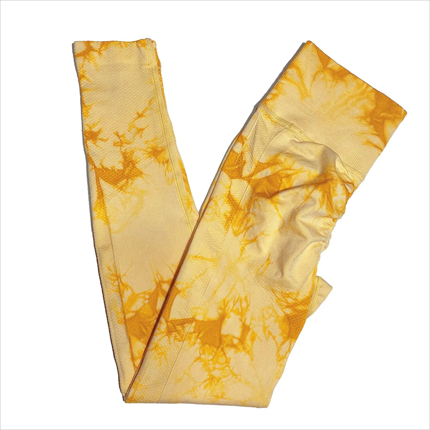 Lifestyle shot of woman wearing yellow leggings during a hike, highlighting versatility for all seasons and activities