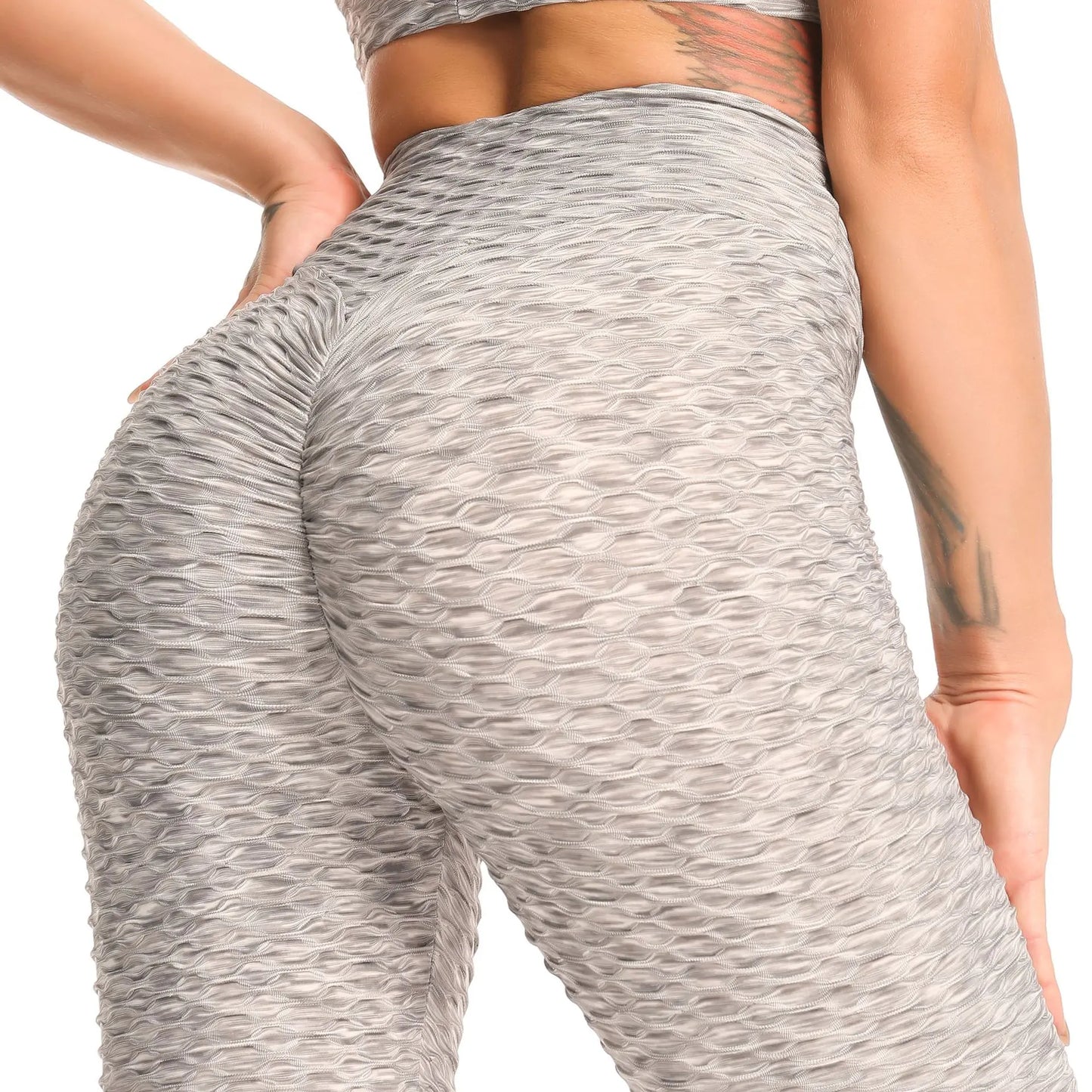 High waist peach-colored hip fitness leggings with a snug fit, flexible fabric, and stylish design for active workouts and casual wear