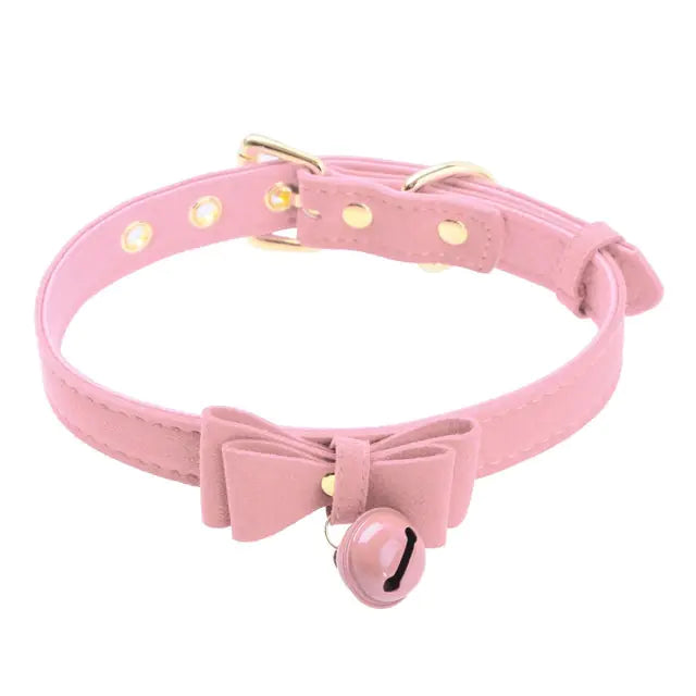 A close-up of a stylish black choker collar necklace featuring a small bell pendant, perfect for fashion-forward accessories and statement jewelry