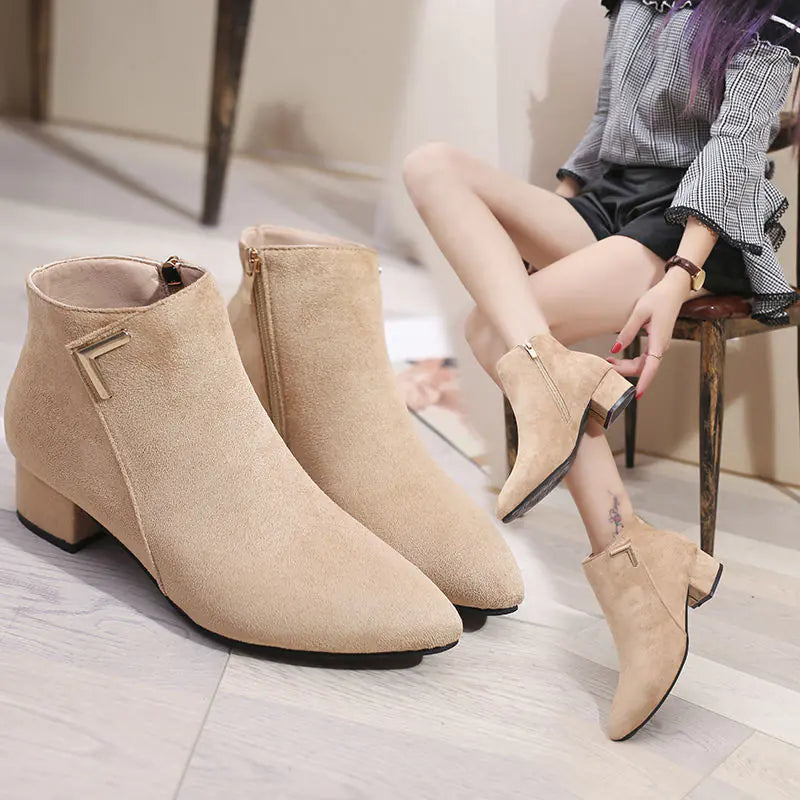 Elegant pointed toe chunky heel ankle boots featuring a sleek side zipper for stylish urban wear