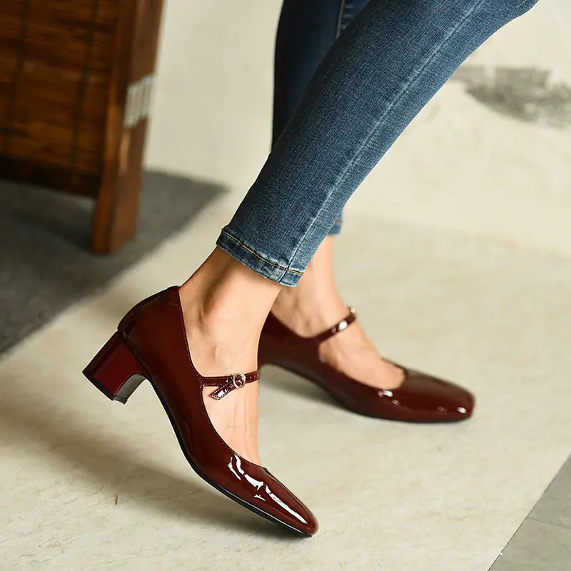 Luxurious burgundy patent finish Mary Jane shoes featuring a sturdy rubber sole for grip
