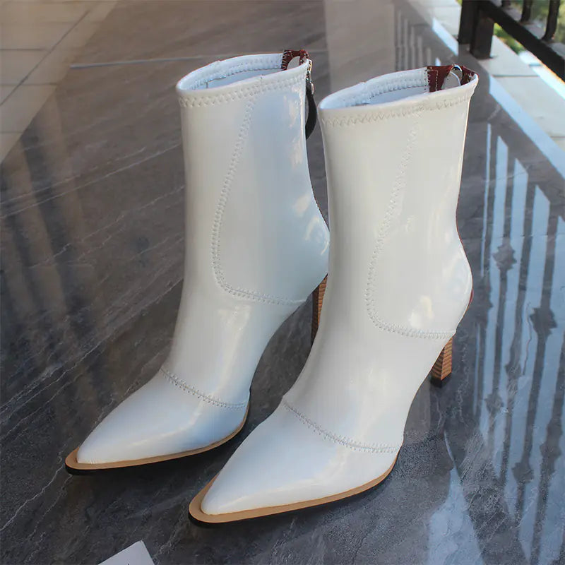 Elegant imported women's leather ankle boots featuring a stylish zipper closure and high-quality craftsmanship
