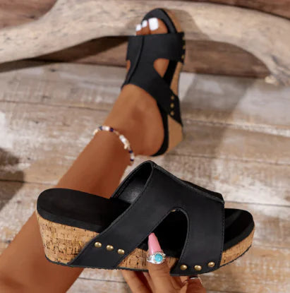 Stylish women’s wedge sandals featuring a round toe design with vibrant flower pattern for casual or semi-formal occasions
