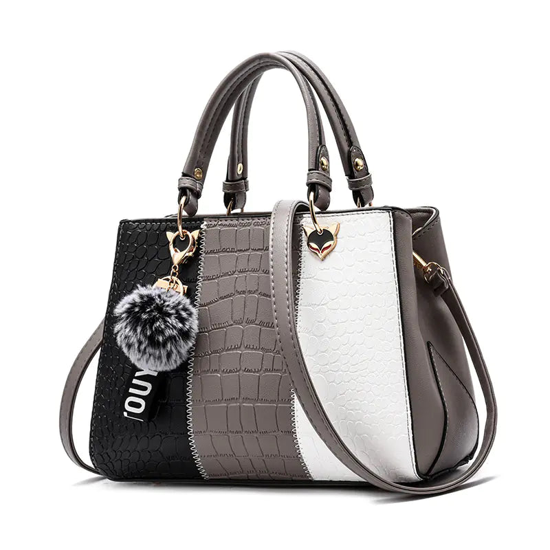 Horizontal square-shaped women's handbag with ample space and secure zipper closure for organization