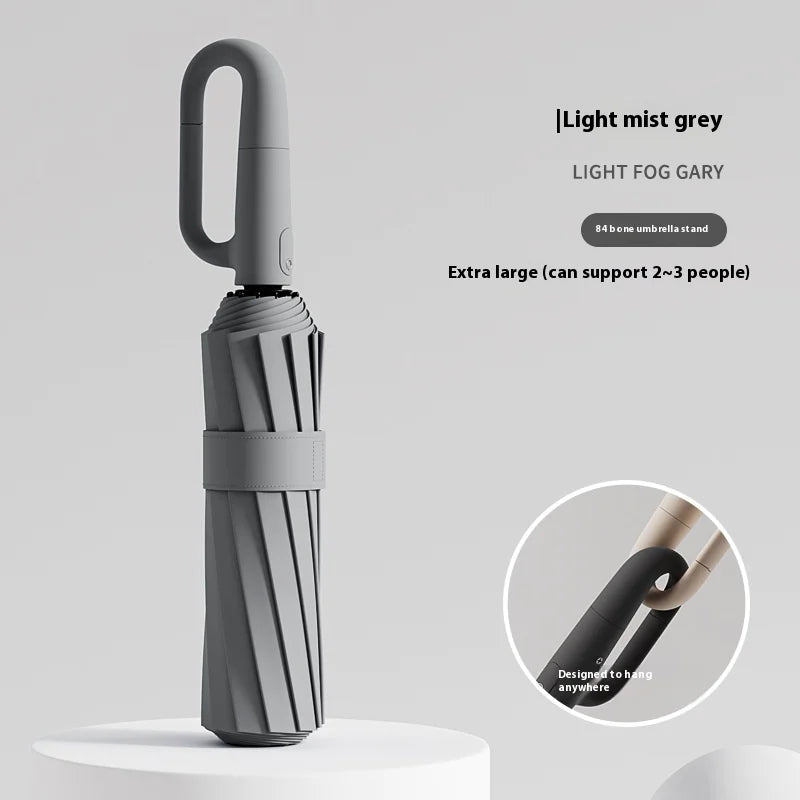 A stylish 84 frames ring buckle umbrella featuring a sturdy handle and durable canopy for rain protection