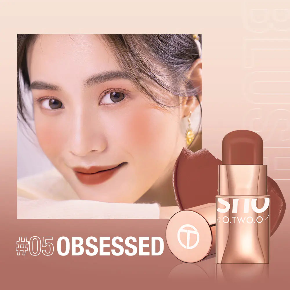 Model applying natural nude blush stick to cheek for a radiant, fresh look