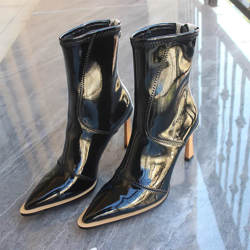 Elegant women's imported leather ankle boots featuring a stylish zipper closure and versatile design