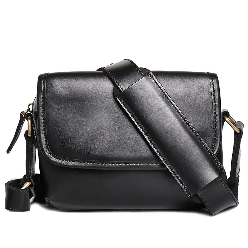 Coffee-colored genuine leather bag with adjustable strap and spacious interior