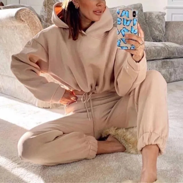 Elegant women's winter two-piece tracksuit set with cozy fleece fabric and stylish design for cold weather comfort