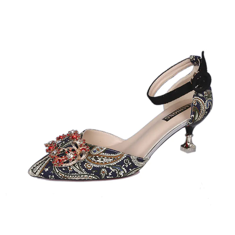 Elegant red pointed toe stiletto heels adorned with sparkling rhinestones, perfect for bridal or formal occasions