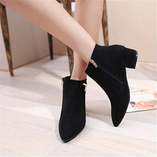 Stylish pointed toe chunky heel ankle boots featuring a side zipper for easy wear, perfect for modern fashion statements