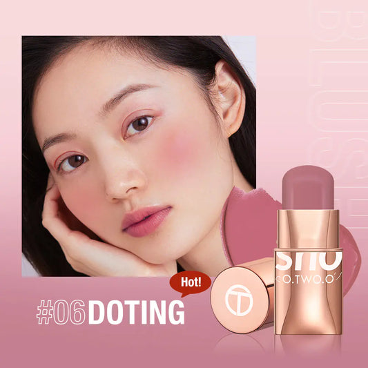 Cream blush stick in natural nude shade applied on smooth cheek skin