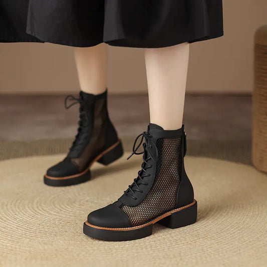Elevated styling with round toe chunky heel leather Martin sandals featuring front tie closure