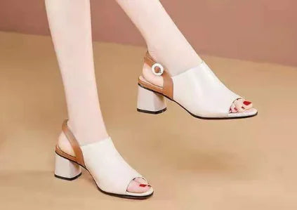 Elegant black high heels with peep toe and color block design featuring adjustable buckle strap