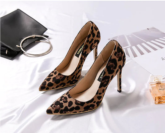 Elegant leopard print stiletto heels featuring a pointed toe design for stylish, bold footwear